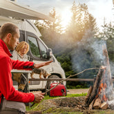 RV parked by a scenic lake with mountains in the background, perfect for weekend campers looking for an off-grid solar power solution